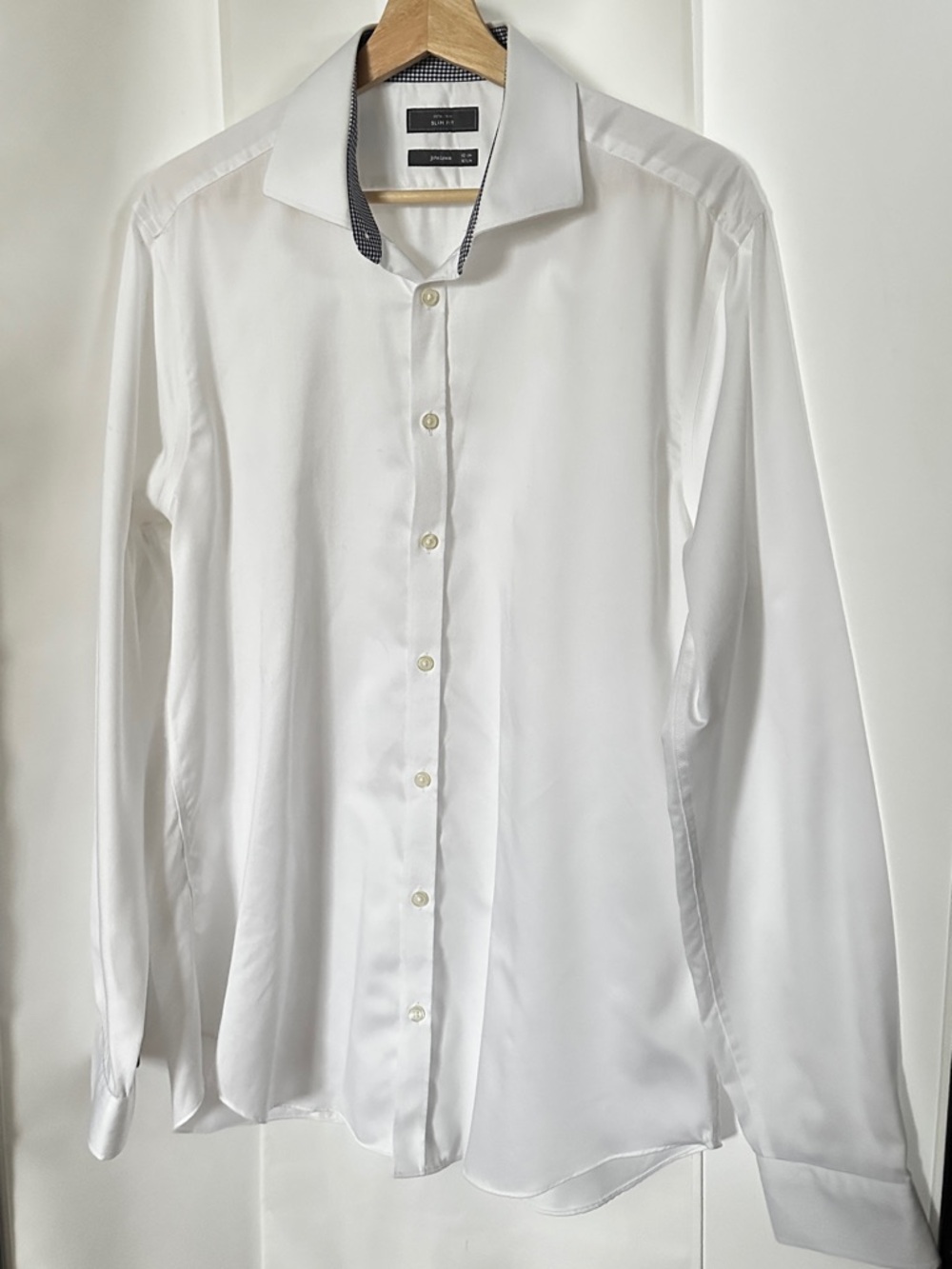 100% Cotton. White dress shirt.